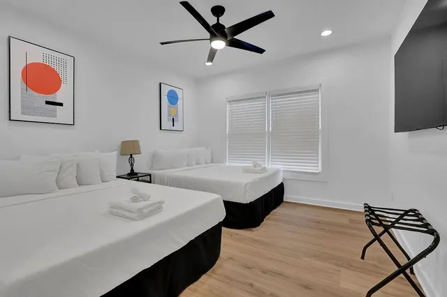 a bedroom with a bed and a window