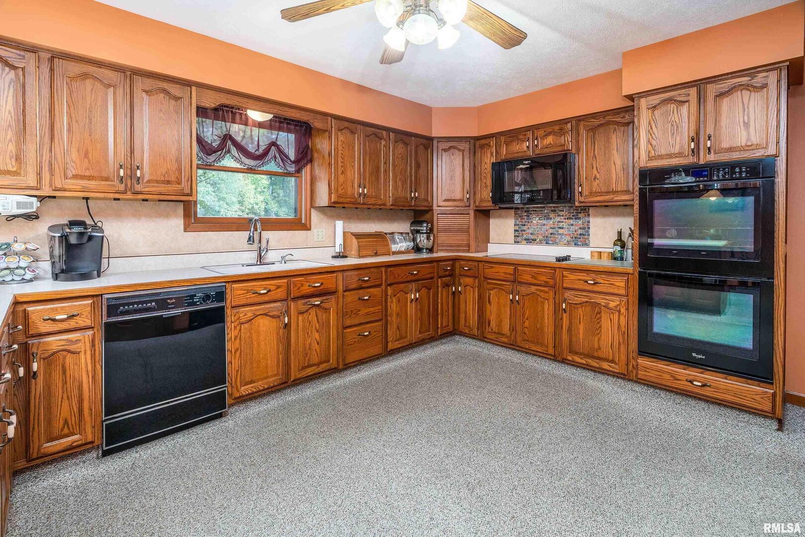 11688 Strawberry Road Carbondale, IL 62901 - Photo 18 of 36 a kitchen with stainless steel appliances granite countertop a sink and cabinets
