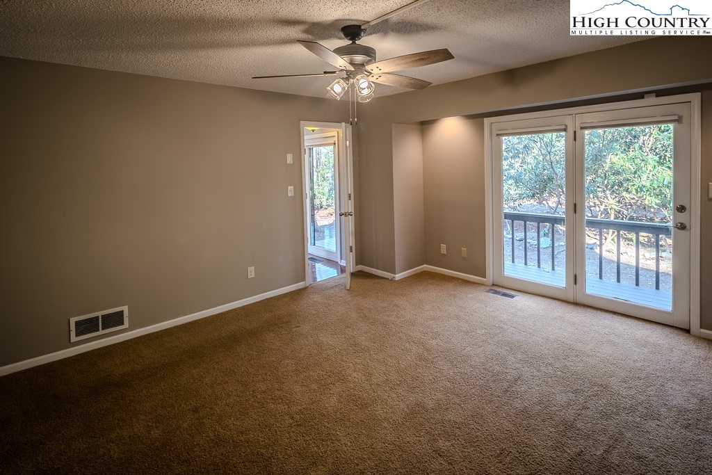 290 Cobble Creek Lane Boone, NC 28607 - Photo 18 of 33 a view of an empty room with a window