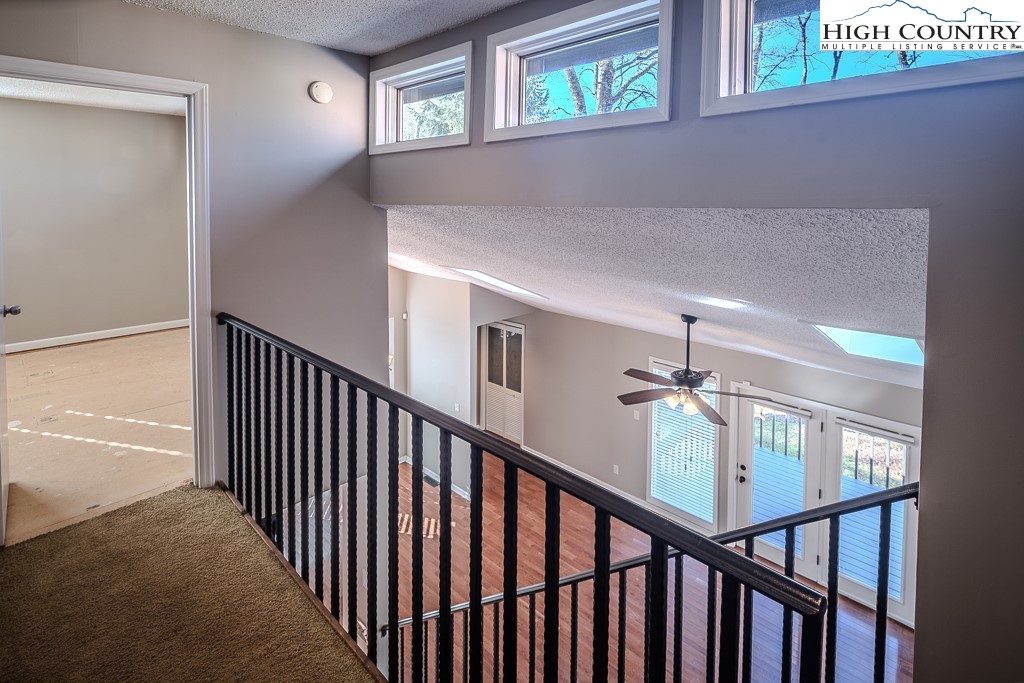 290 Cobble Creek Lane Boone, NC 28607 - Photo 23 of 33 a view of staircase with railing and a window