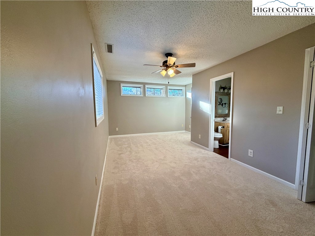 290 Cobble Creek Lane Boone, NC 28607 - Photo 24 of 33 a view of a hallway with a chandelier