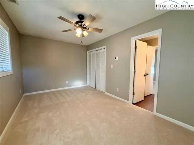 a view of room that has white walls