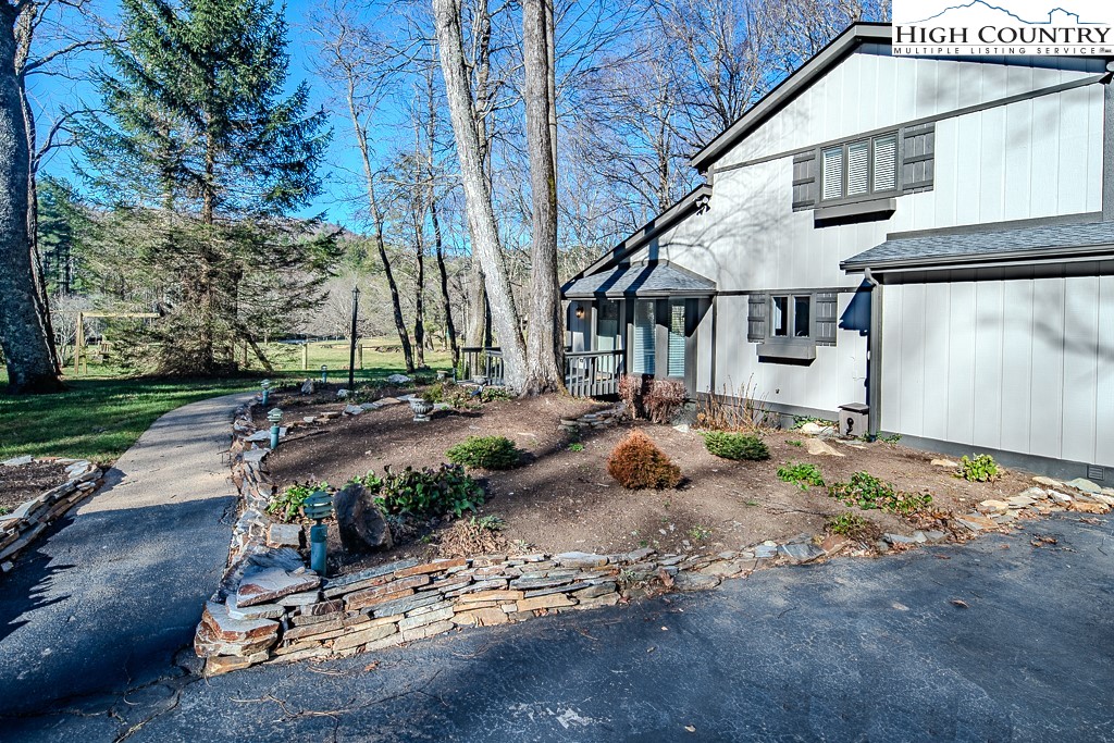 290 Cobble Creek Lane Boone, NC 28607 - Photo 5 of 33 a front view of a house with a yard