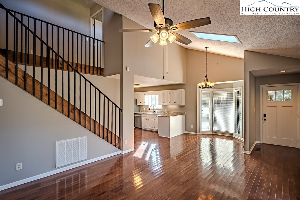 290 Cobble Creek Lane Boone, NC 28607 - Photo 9 of 33 a view of a hallway with wooden floor and staircase
