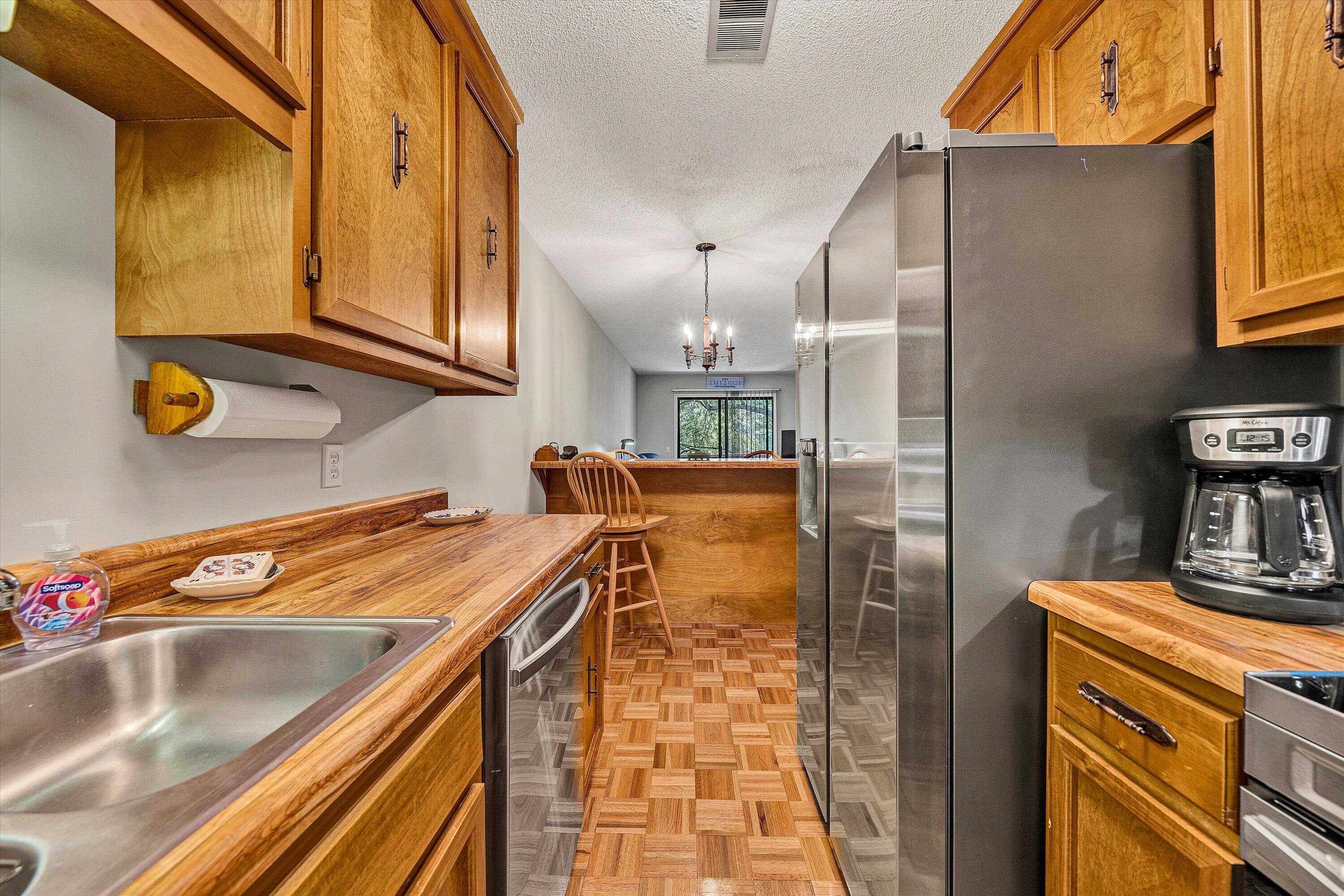 620 Monte Vista Road, Unit 605 Union Hall, VA 24176 - Photo 13 of 41 a kitchen with stainless steel appliances granite countertop a sink a stove and a refrigerator