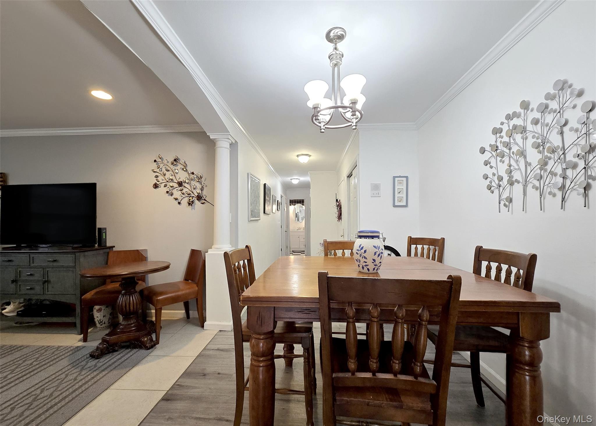 460 Old Town Road, Unit 5B East Setauket, NY 11772 - Photo 3 of 12 a view of a dining room with furniture and wooden floor