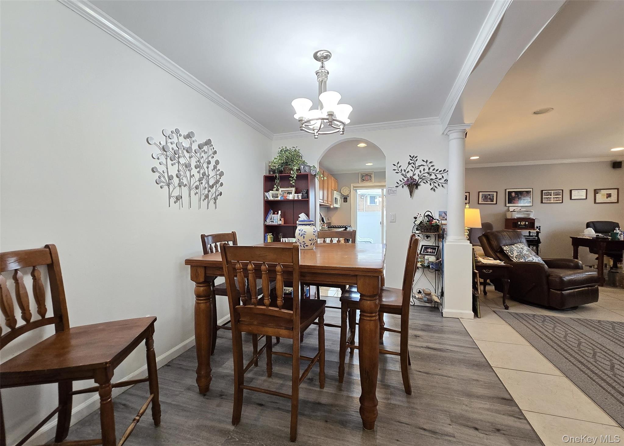 460 Old Town Road, Unit 5B East Setauket, NY 11772 - Photo 4 of 12 a view of a dining room with furniture and chandelier