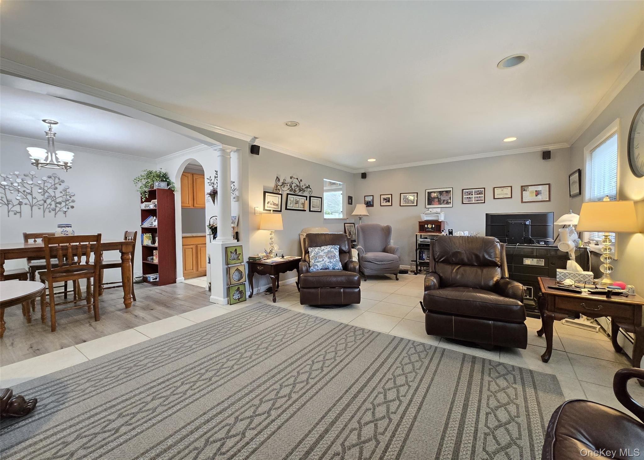 460 Old Town Road, Unit 5B East Setauket, NY 11772 - Photo 6 of 12 a living room with furniture and wooden floor