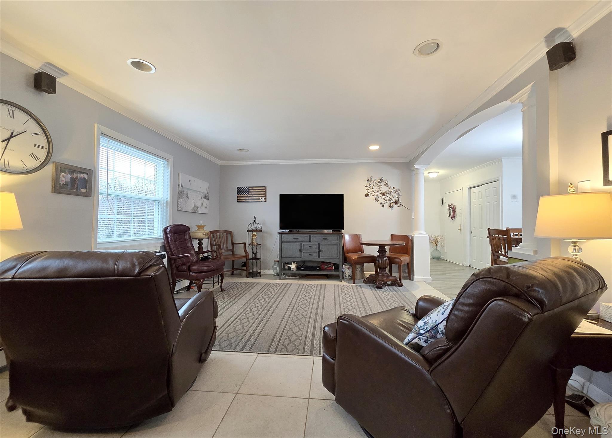 460 Old Town Road, Unit 5B East Setauket, NY 11772 - Photo 7 of 12 a living room with furniture and a flat screen tv