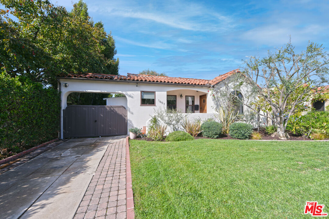 1657 South Point View Street Los Angeles, CA 90035 - Photo 2 of 50 a front view of a house with a yard