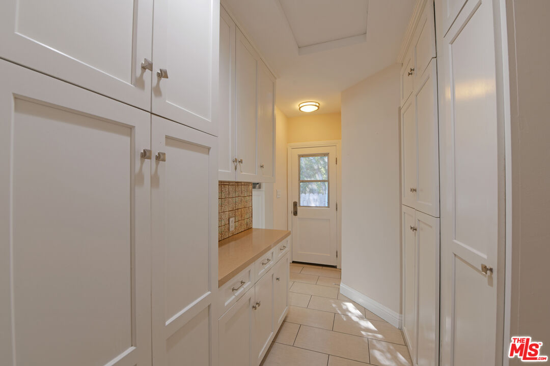 1657 South Point View Street Los Angeles, CA 90035 - Photo 14 of 50 a view of a hallway with wooden floor