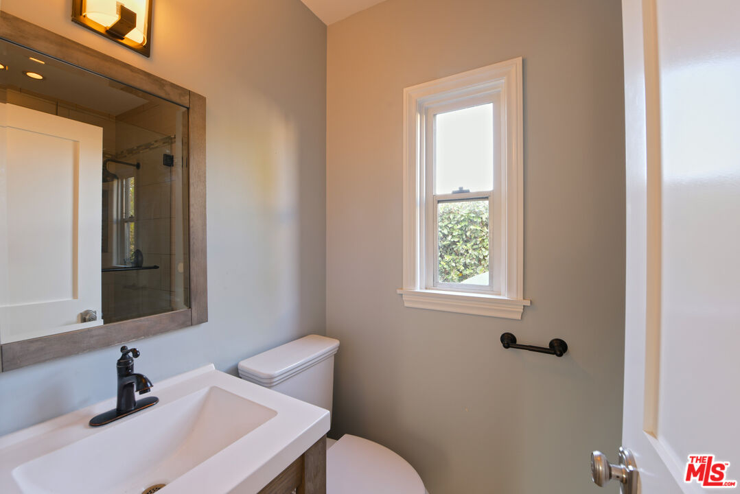 1657 South Point View Street Los Angeles, CA 90035 - Photo 17 of 50 a bathroom with a sink and a toilet