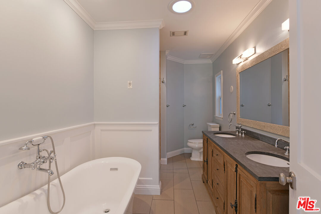 1657 South Point View Street Los Angeles, CA 90035 - Photo 26 of 50 a bathroom with a bathtub and a sink