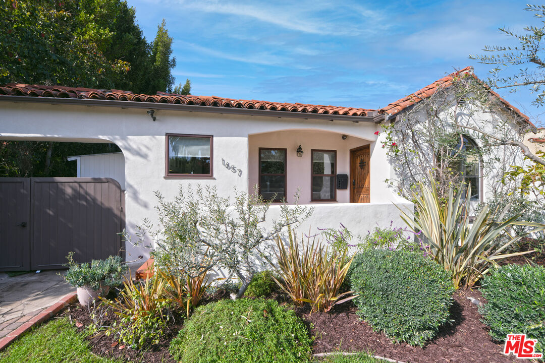 1657 South Point View Street Los Angeles, CA 90035 - Photo 4 of 50 front view of a house with a big yard