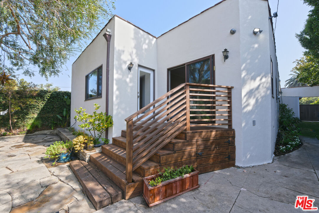 1657 South Point View Street Los Angeles, CA 90035 - Photo 32 of 50 a front view of a house with a yard
