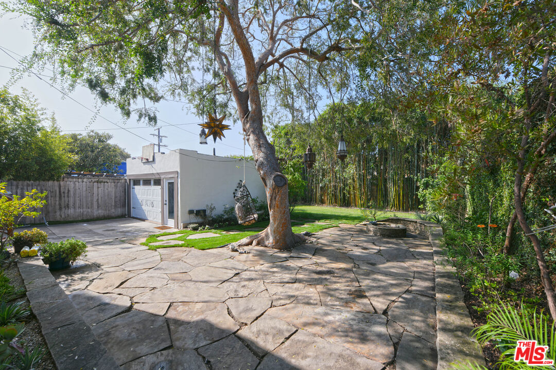 1657 South Point View Street Los Angeles, CA 90035 - Photo 42 of 50 a view of a yard with plants and tree