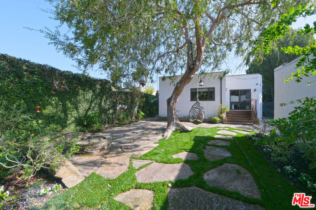 1657 South Point View Street Los Angeles, CA 90035 - Photo 49 of 50 a front view of a house with garden