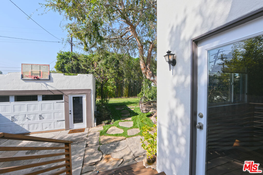 1657 South Point View Street Los Angeles, CA 90035 - Photo 50 of 50 a view of a house with backyard and sitting area