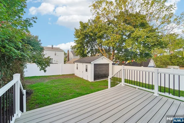 a view of a deck with a yard