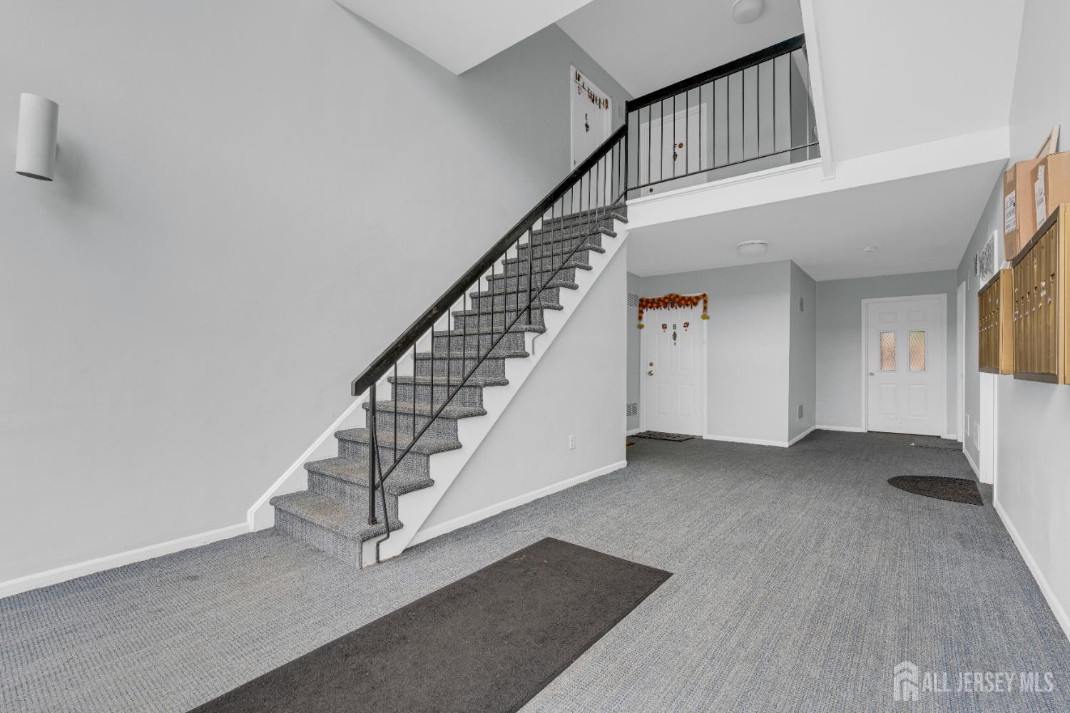 101 Beverly Hl Terrace, Unit M Woodbridge, NJ 07095 - Photo 3 of 28 a view of staircase with white walls and a window