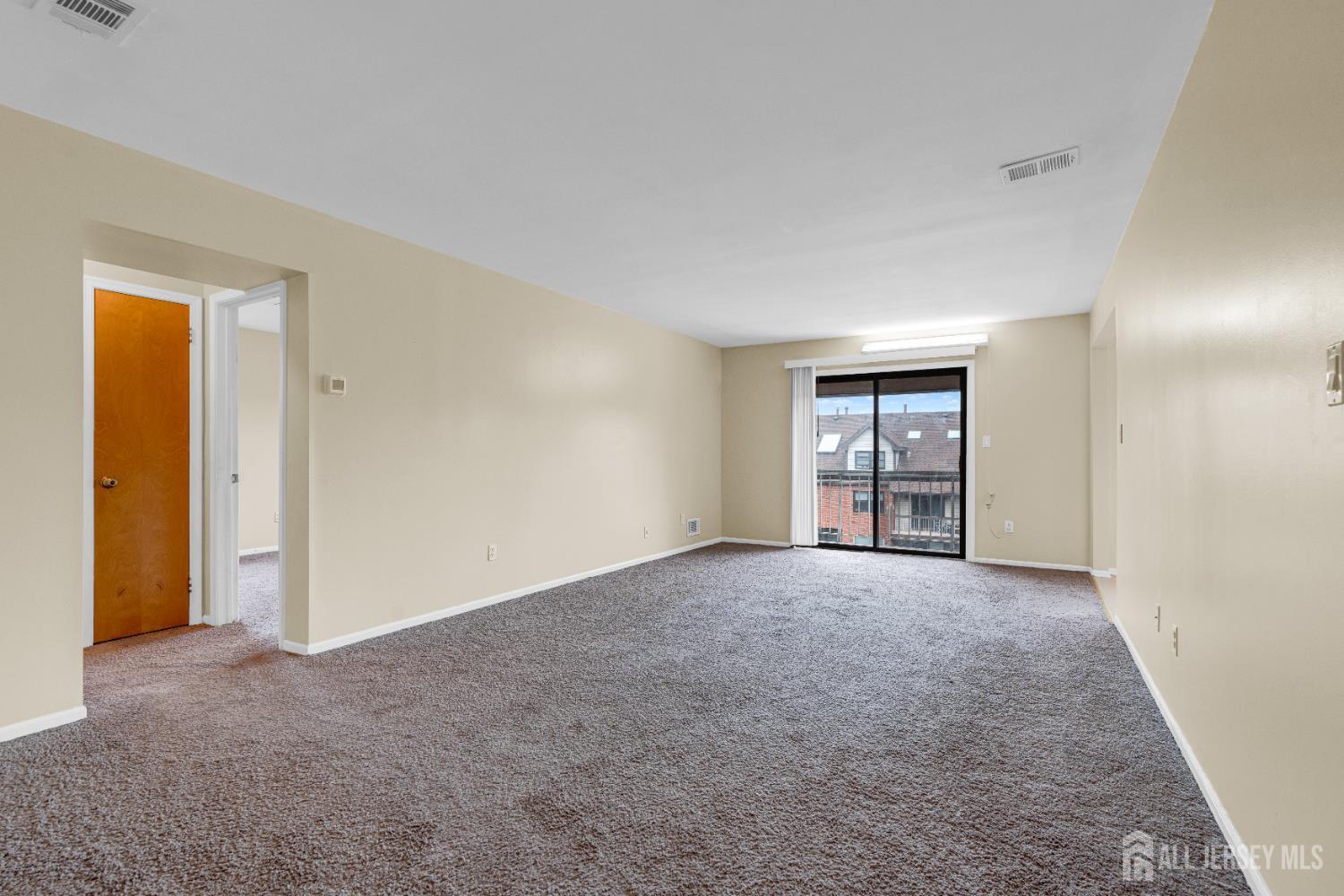 101 Beverly Hl Terrace, Unit M Woodbridge, NJ 07095 - Photo 7 of 28 a view of an empty room with closet and window