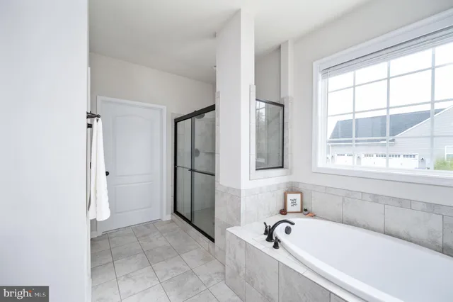 a kitchen with granite countertop stainless steel appliances wooden cabinets and a sink