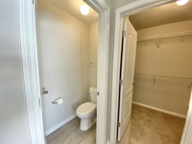 a bathroom with a toilet and shower