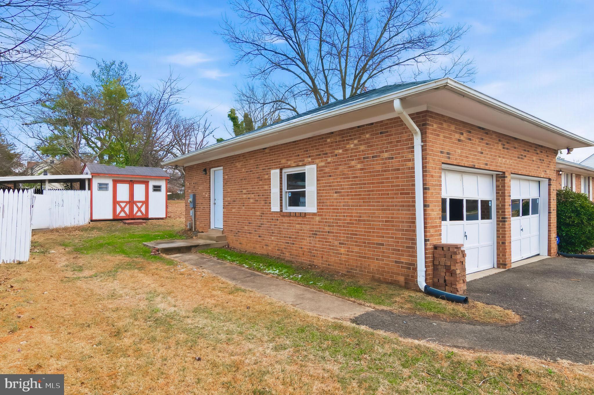 3723 Munson Road Falls Church, VA 22041 - Photo 6 of 30 a view of a house with a yard and garage