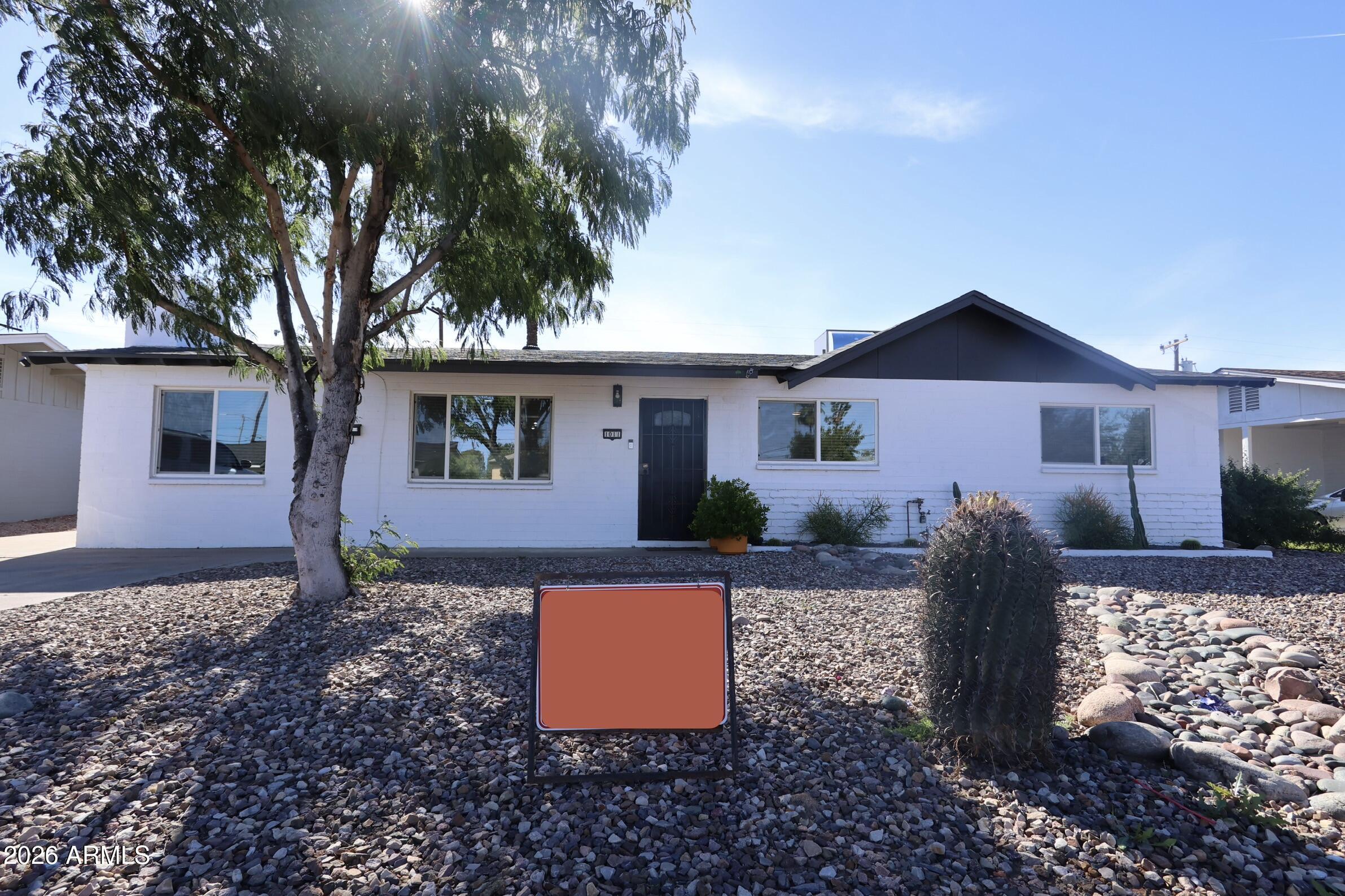 1011 West Elna Rae Street Tempe, AZ 85281 - Photo 2 of 30 a front view of a house with garden