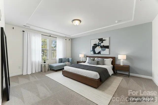 a spacious bathroom with double sink and a mirror