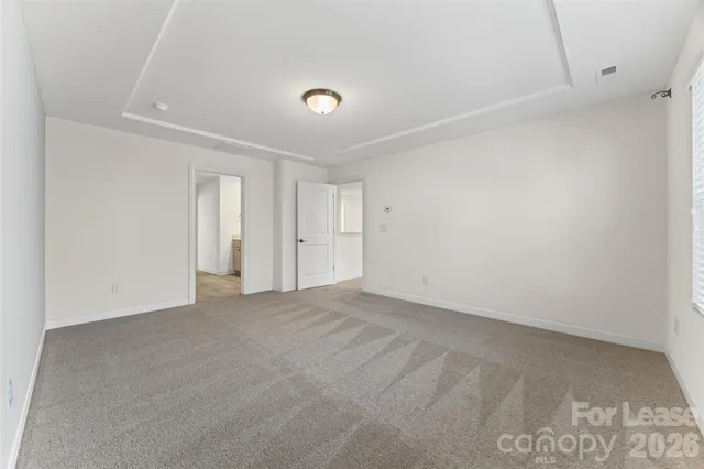 a utility room with cabinets washer and dryer