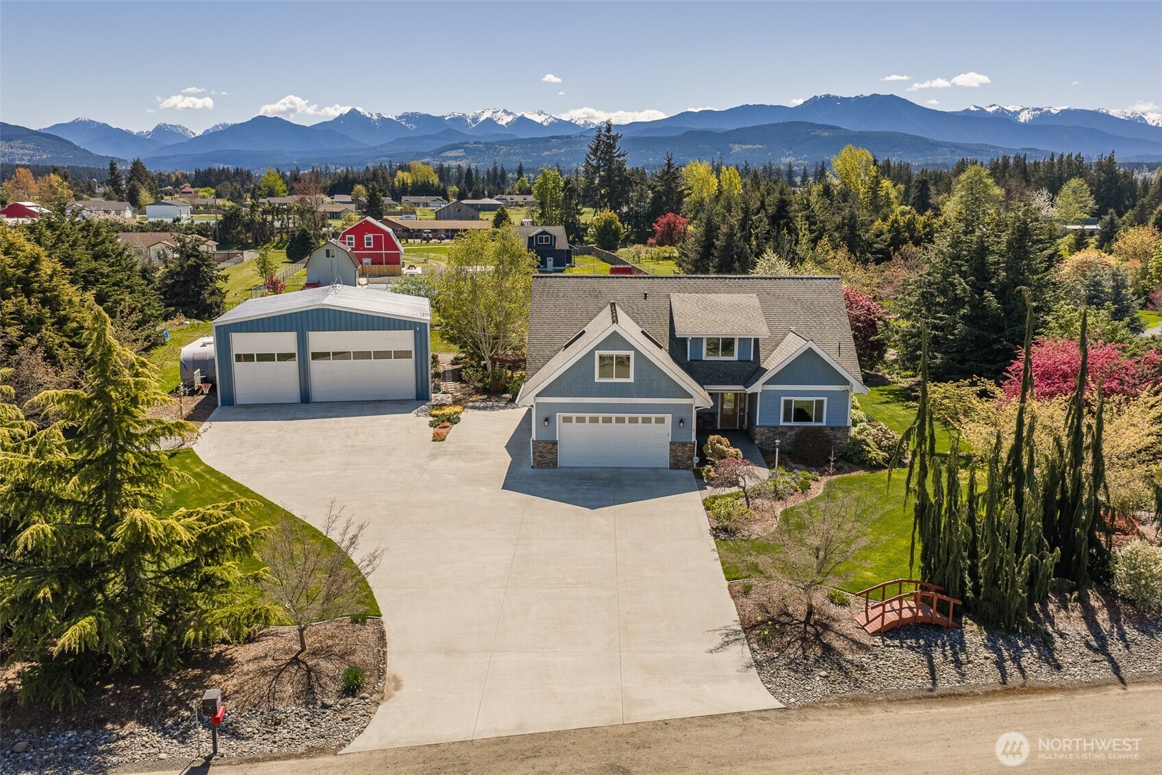 a view of a house with a mountain in the background
