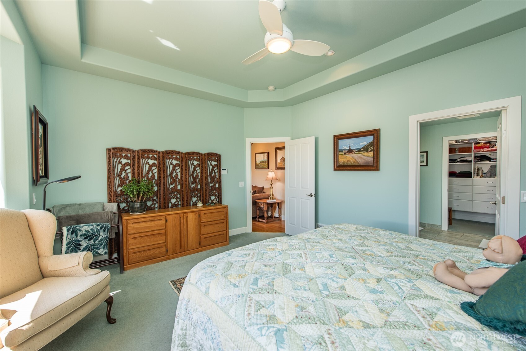 141 Pheasant Run Drive Sequim, WA 98382 - Photo 15 of 40 a bedroom with a bed and dresser with mirror