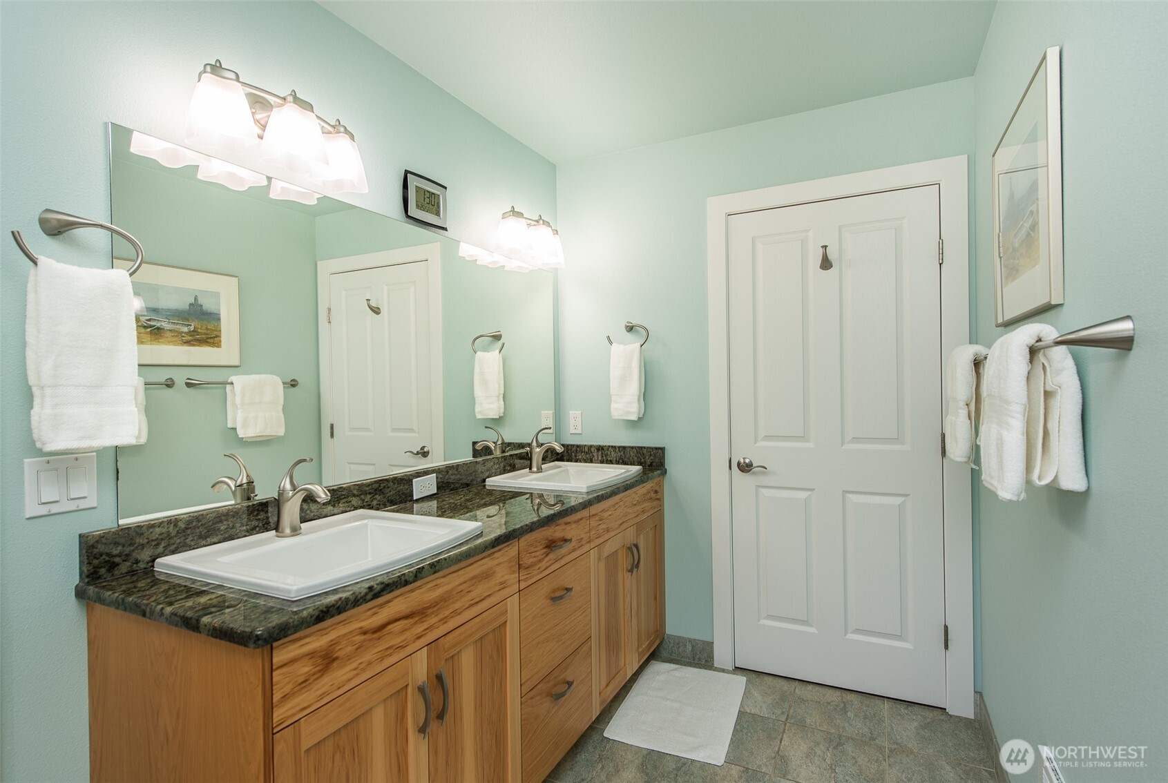 141 Pheasant Run Drive Sequim, WA 98382 - Photo 16 of 40 a bathroom with a granite countertop sink and a mirror