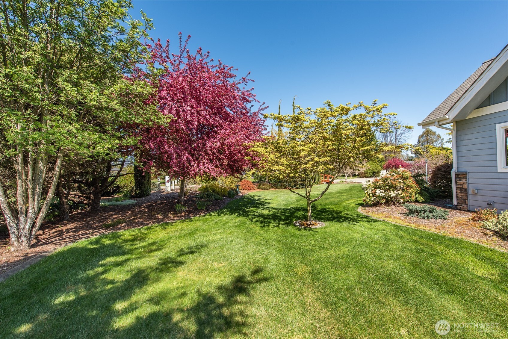 141 Pheasant Run Drive Sequim, WA 98382 - Photo 33 of 40 a backyard of a house with lots of green space