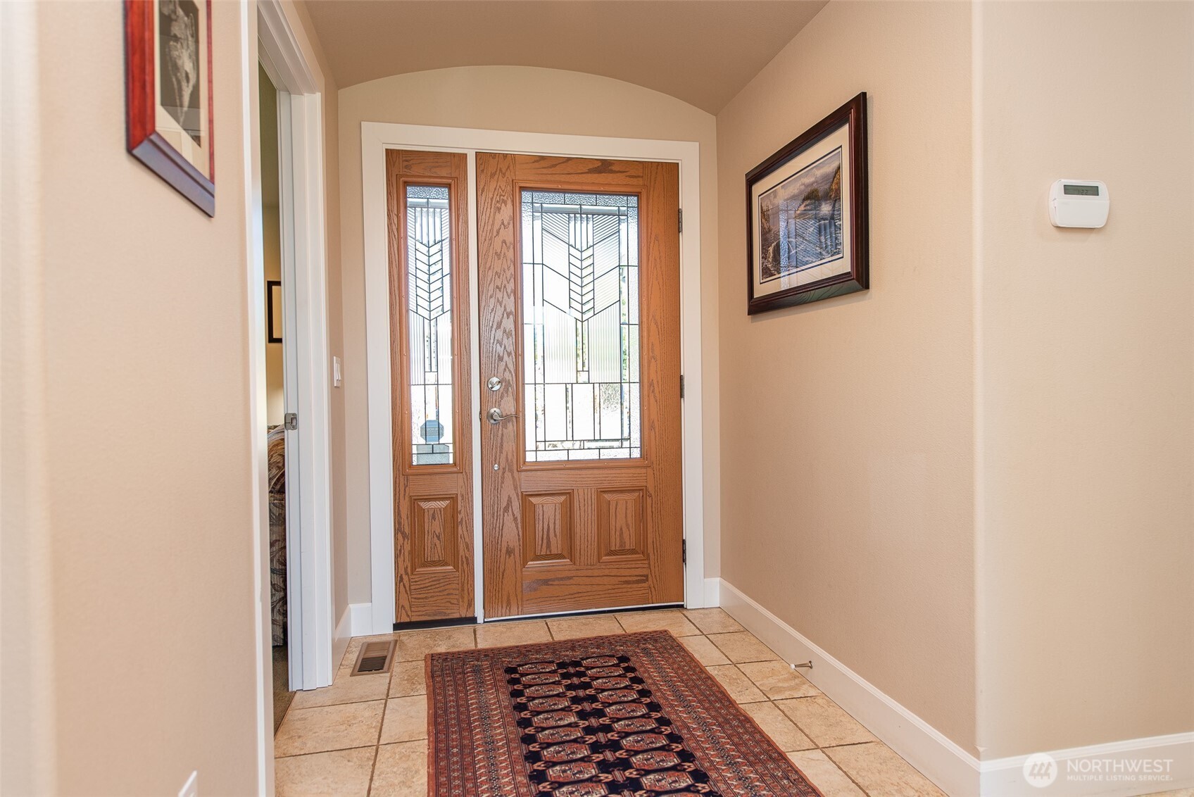 141 Pheasant Run Drive Sequim, WA 98382 - Photo 4 of 40 a view of front door with a bench