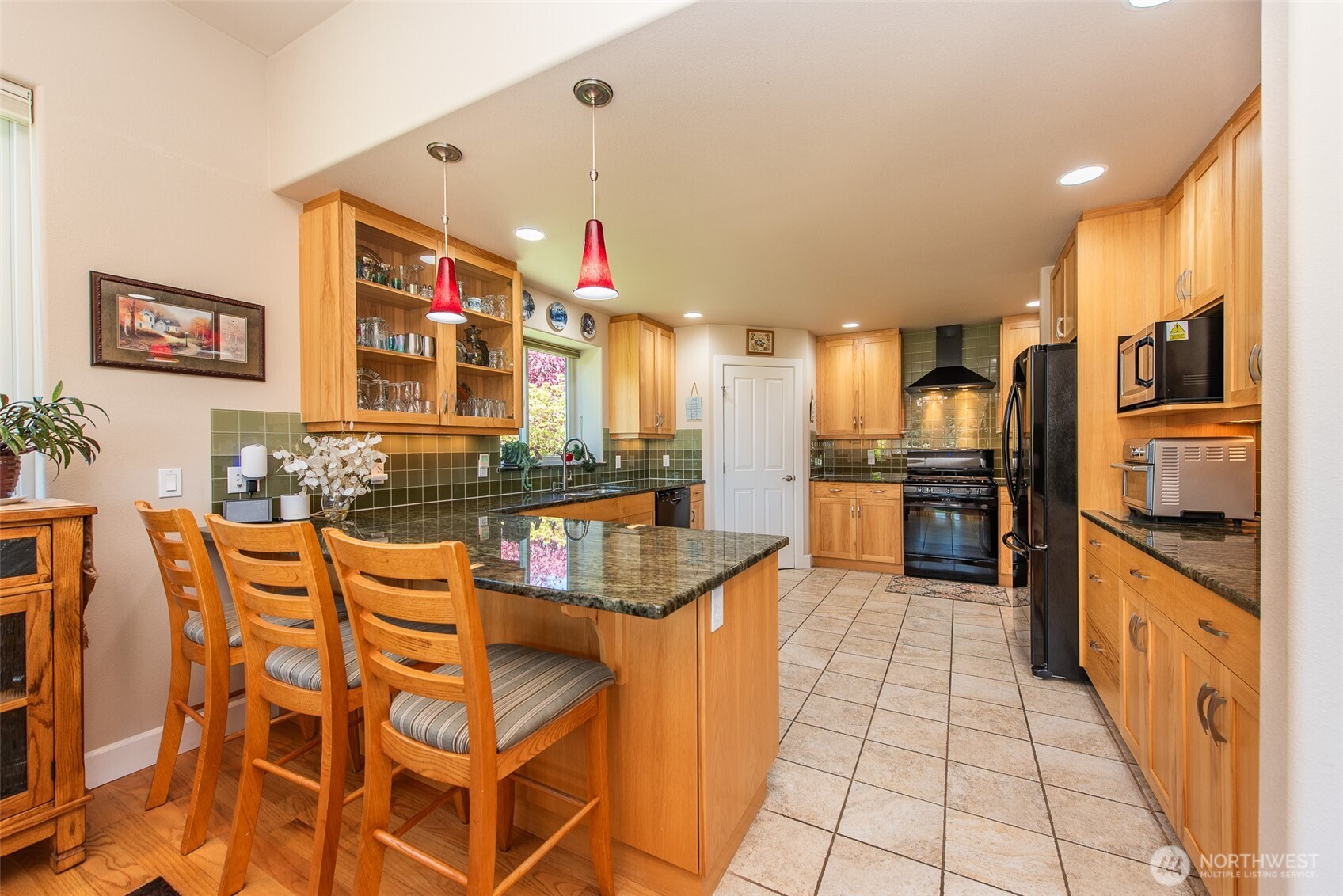 141 Pheasant Run Drive Sequim, WA 98382 - Photo 7 of 40 a kitchen with stainless steel appliances granite countertop a sink and cabinets