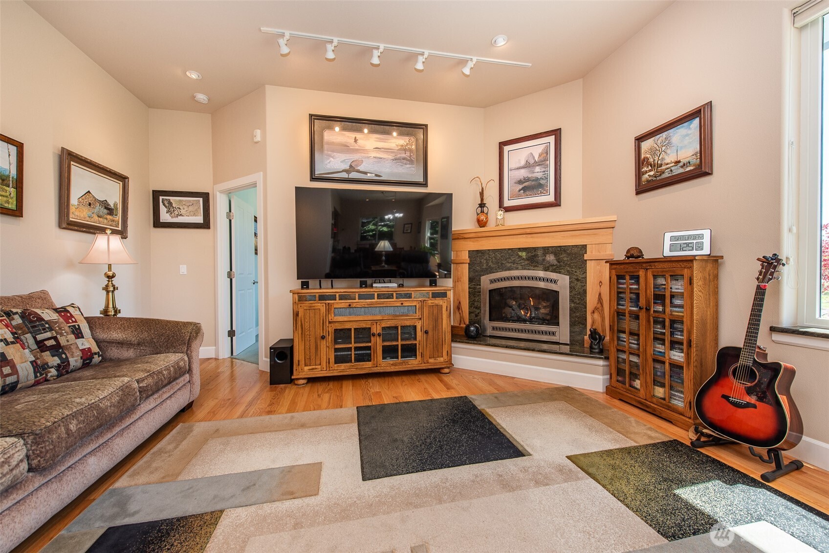 141 Pheasant Run Drive Sequim, WA 98382 - Photo 10 of 40 a living room with furniture and a flat screen tv