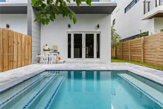 a balcony with table and chairs