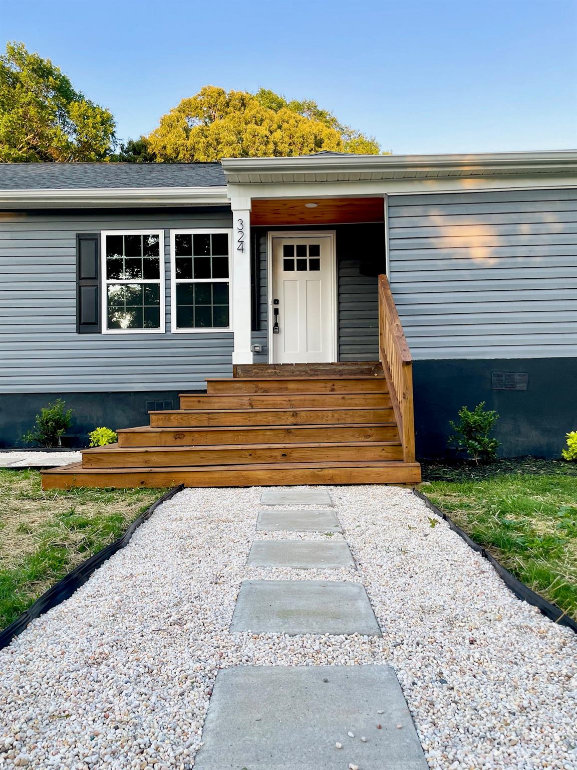 324 South Rhyne Street Gastonia, NC 28054 - Photo 11 of 11 a view of a house with a small yard and a large window