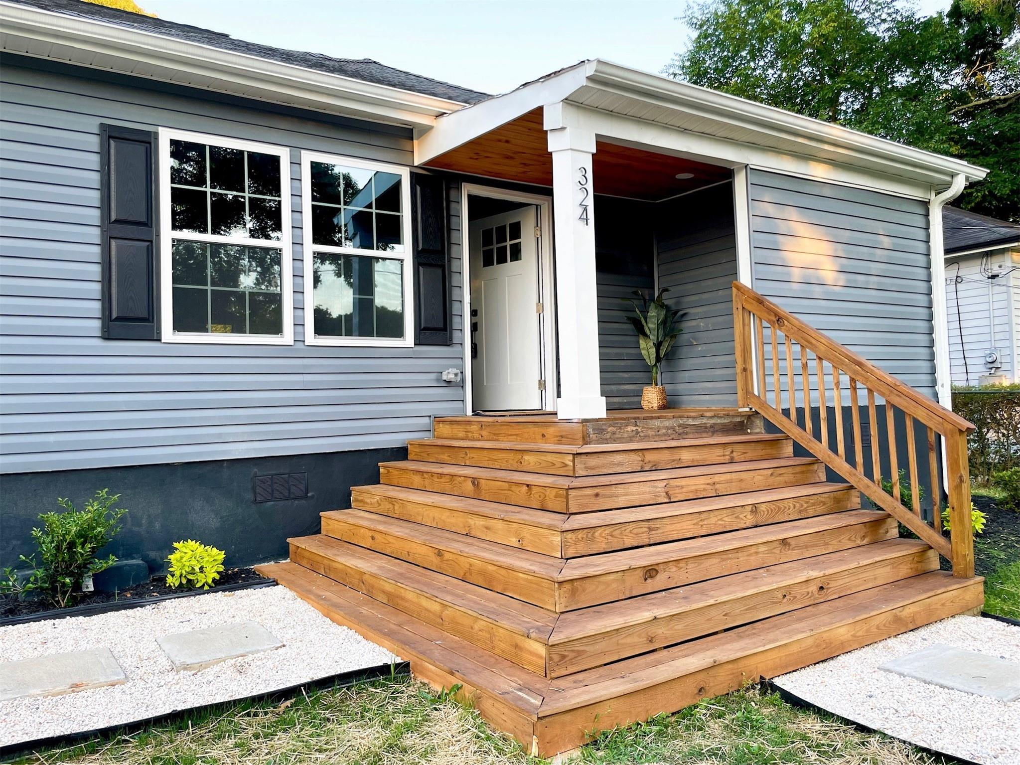 324 South Rhyne Street Gastonia, NC 28054 - Photo 2 of 11 a front view of a house with a garden