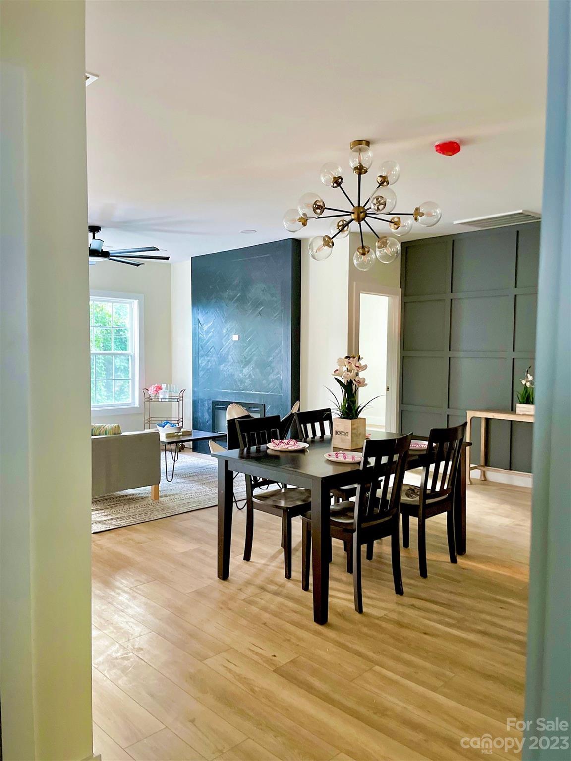 324 South Rhyne Street Gastonia, NC 28054 - Photo 7 of 11 a view of a a dining room with furniture window and wooden floor