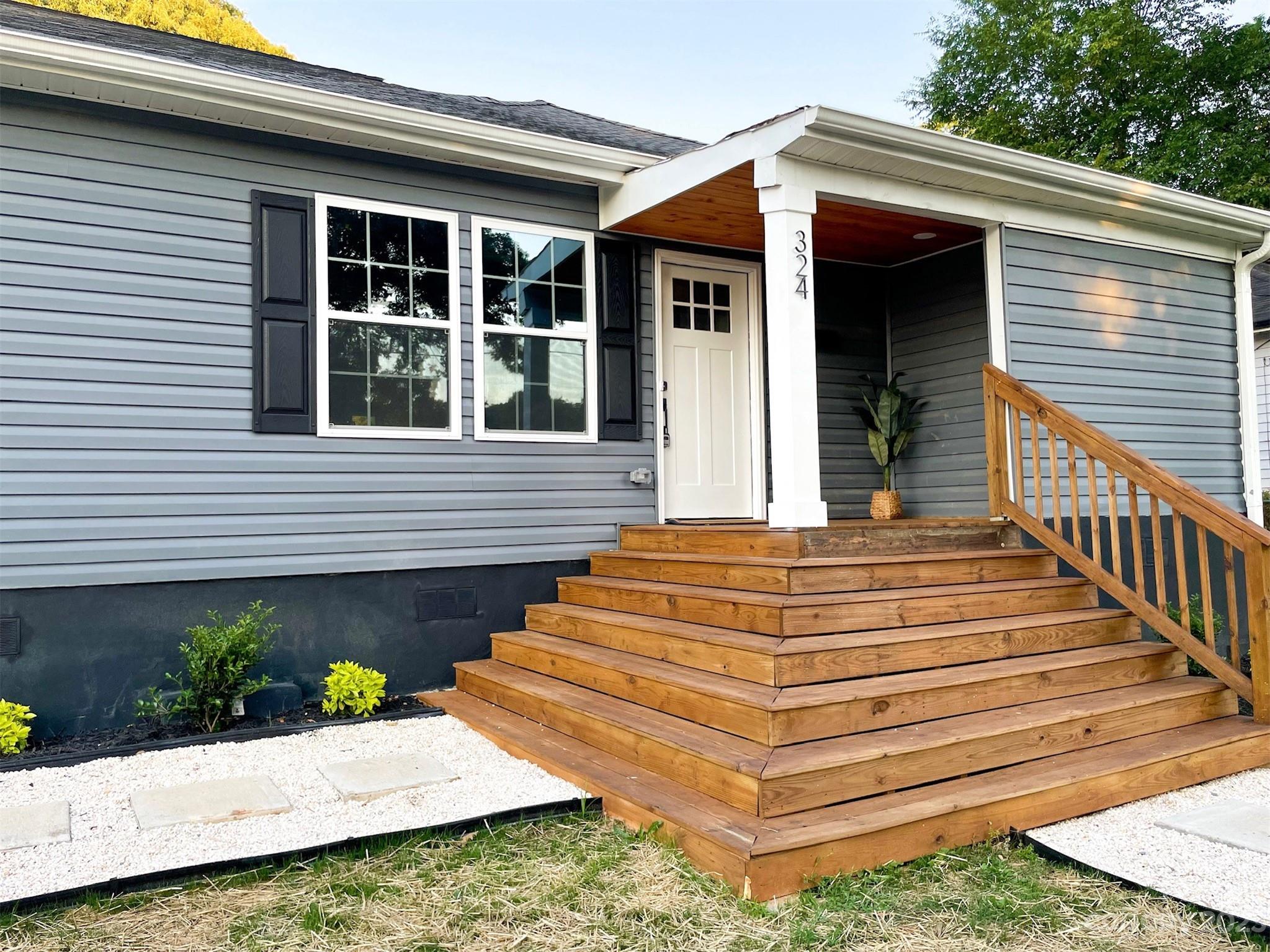 324 South Rhyne Street Gastonia, NC 28054 - Photo 9 of 11 a front view of a house with a yard