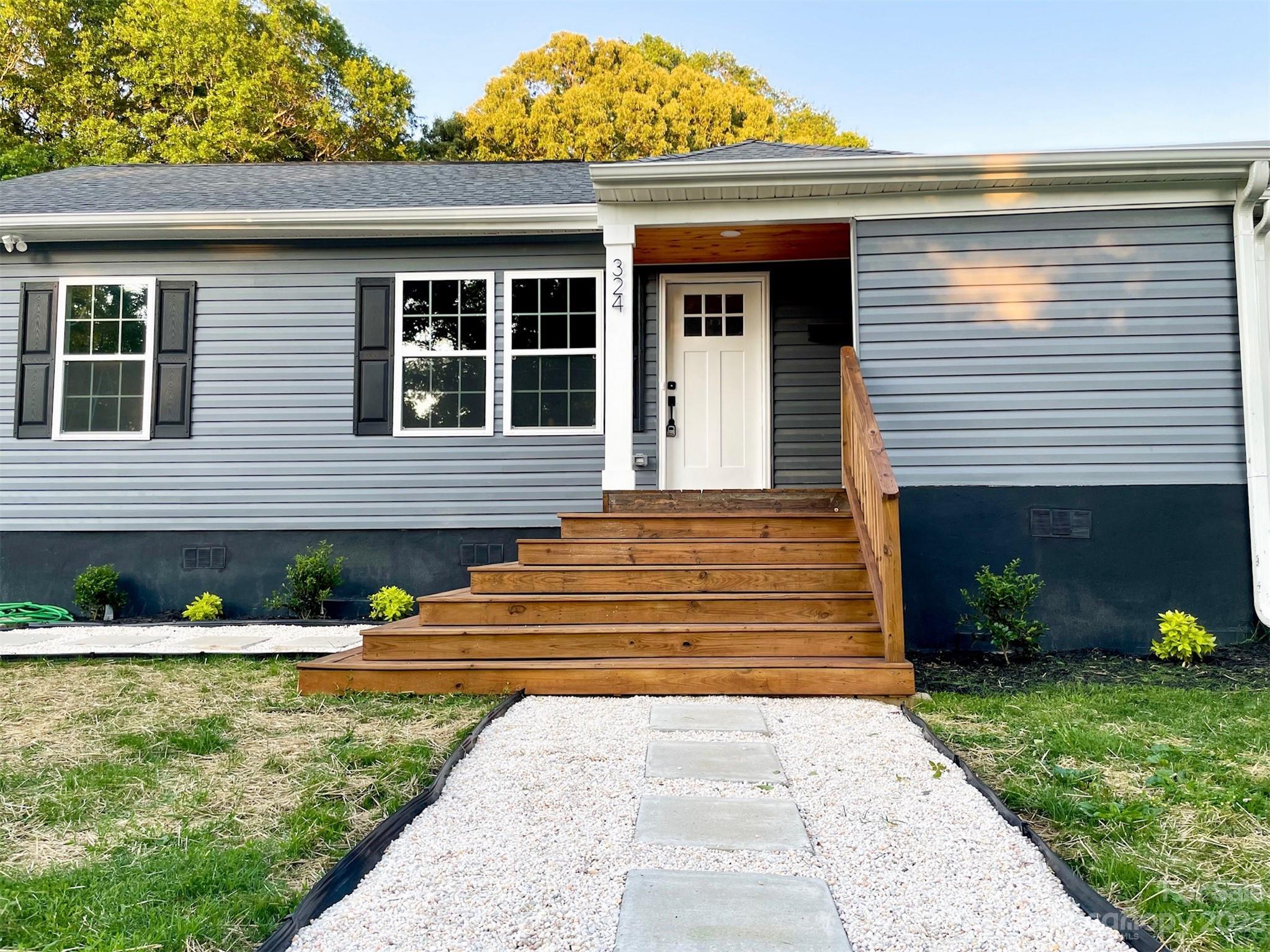 324 South Rhyne Street Gastonia, NC 28054 - Photo 10 of 11 a front view of house with a garden