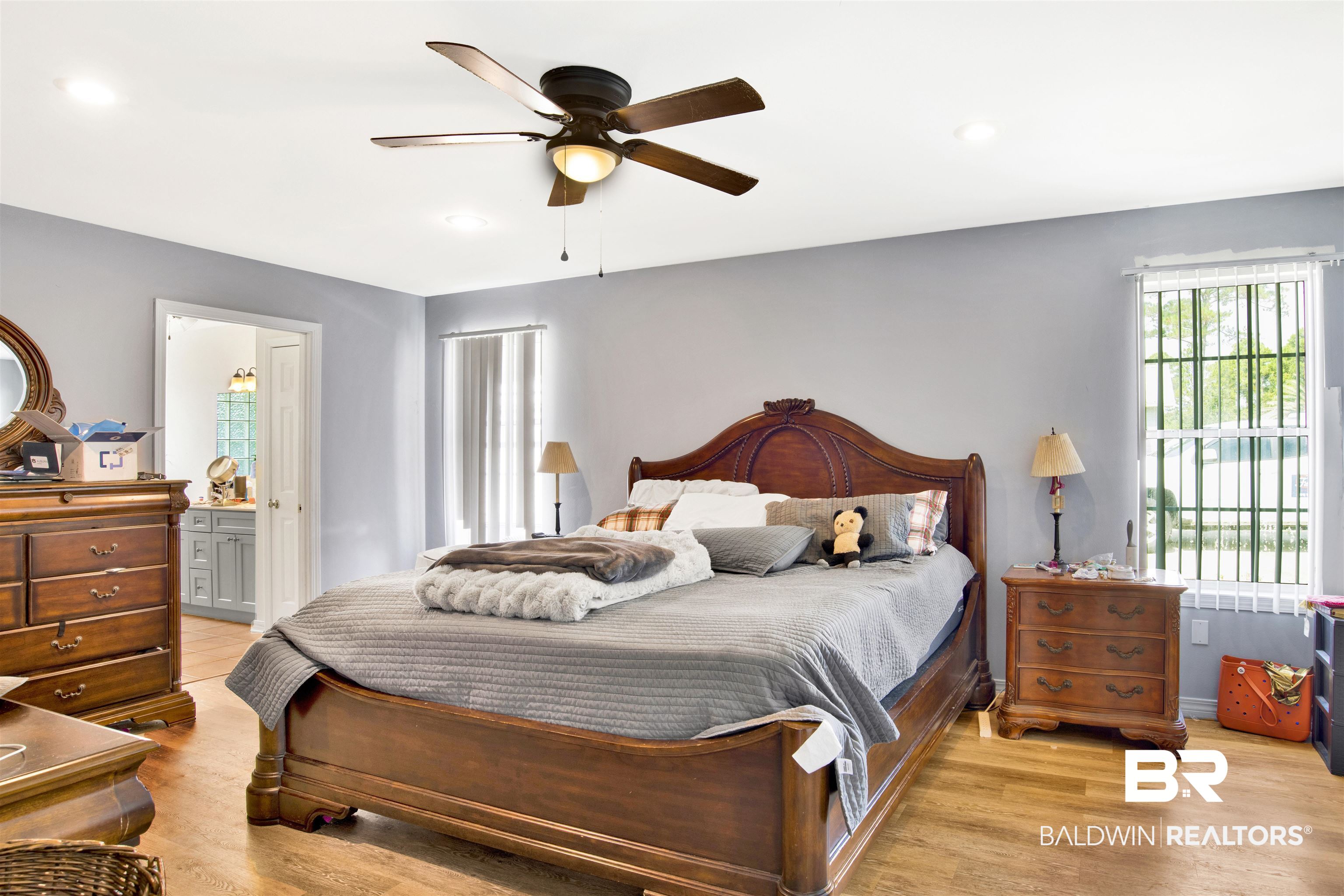 24384 Sailfish Lane Orange Beach, AL 36561 - Photo 13 of 23 Bedroom with ceiling fan, connected bathroom, and light hardwood / wood-style flooring
