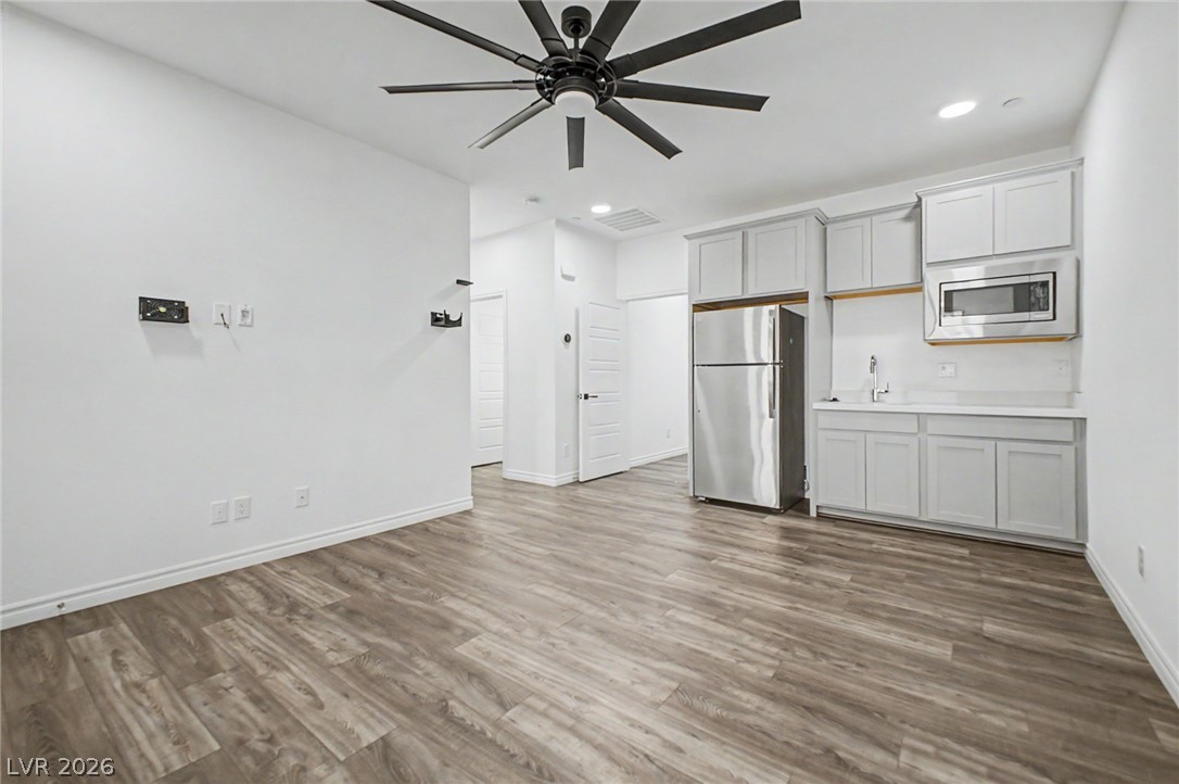 226 Augusta Ridge Henderson, NV 89015 - Photo 21 of 47 This bright, open concept living area features sleek flooring and a compact kitchen.