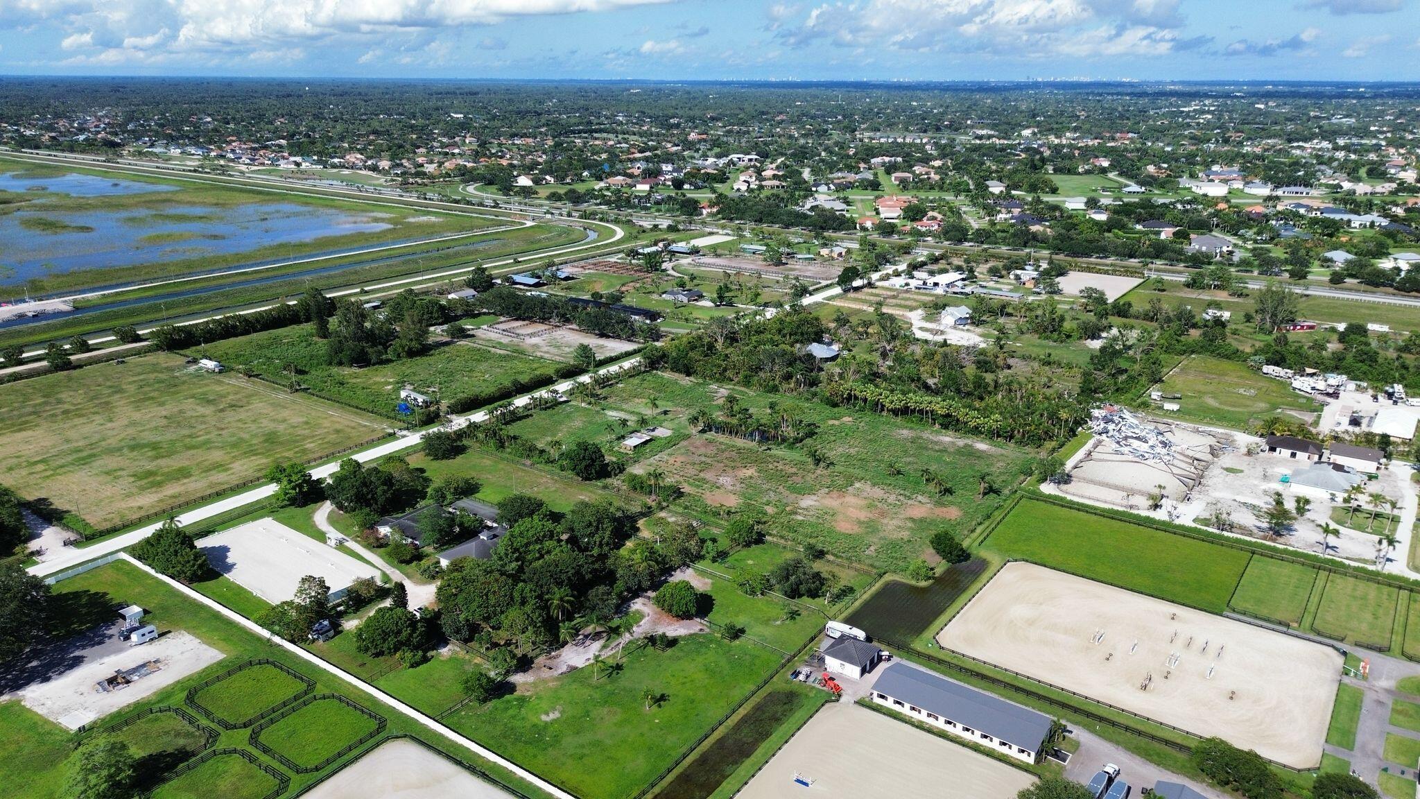 16290 Rustic Road Wellington, FL 33470 - Photo 11 of 20 an aerial view of a residential houses with outdoor space and river