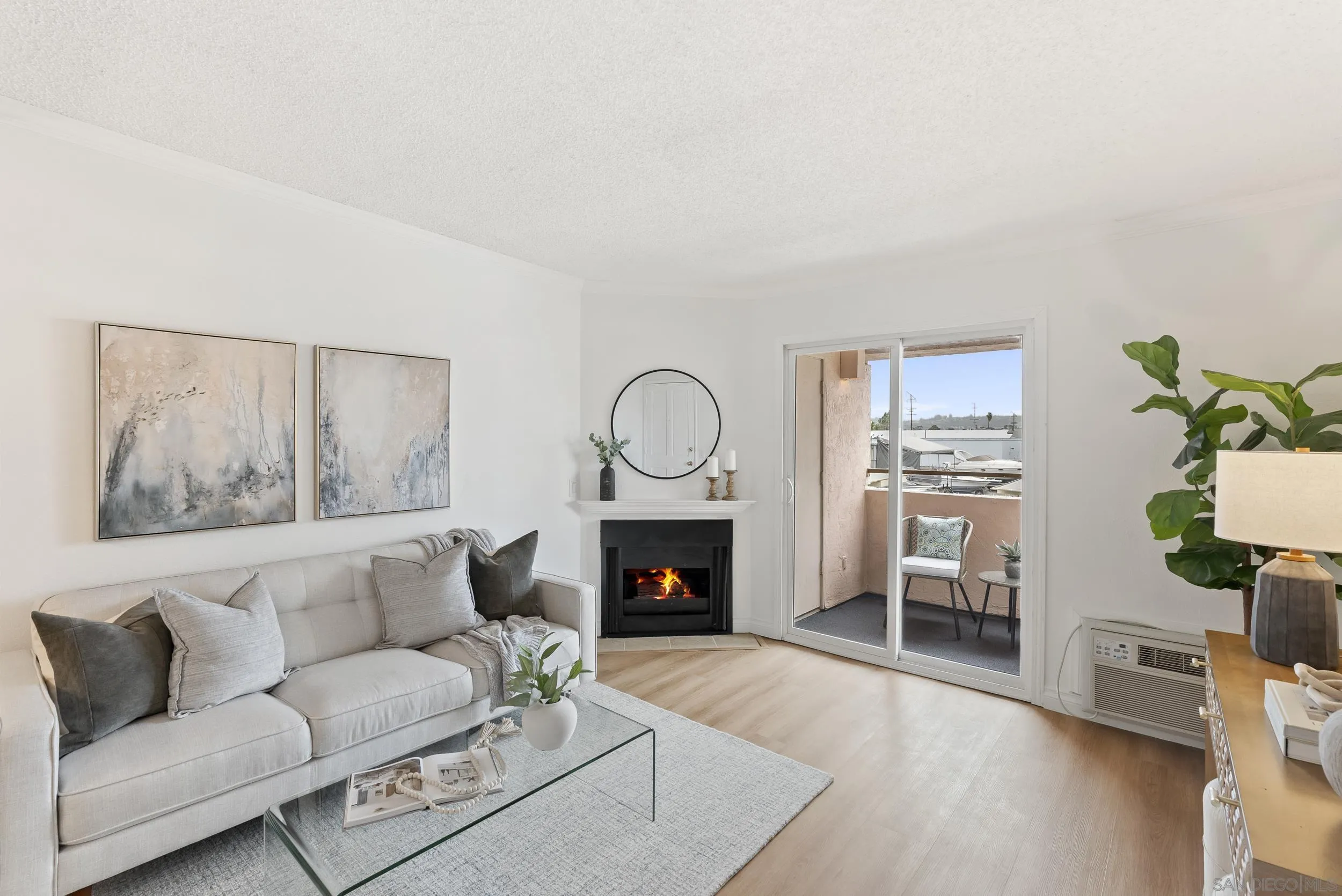 830 Broadway, Unit 15 El Cajon, CA 92021 - Photo 4 of 21 a living room with furniture a fireplace and a potted plant