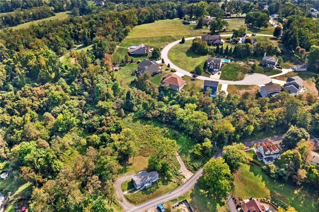 37 B Harding Street Manor, PA 15665 - Photo 5 of 18 an aerial view of residential house with outdoor space and trees all around