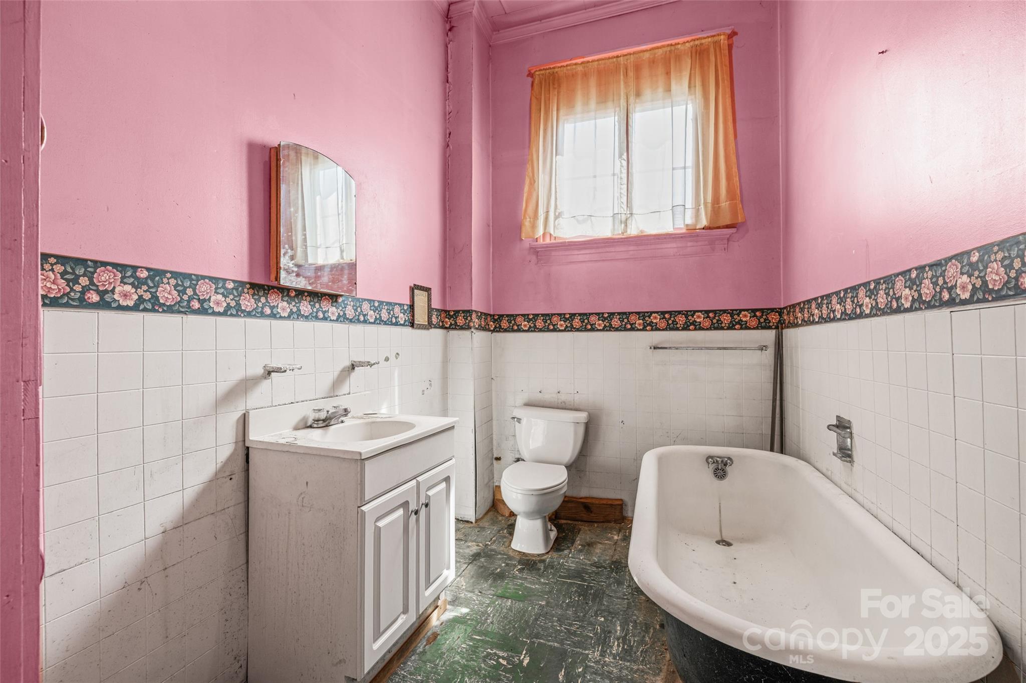 108 Walker Street Chester, SC 29706 - Photo 15 of 31 a bathroom with a sink a toilet a mirror and tub